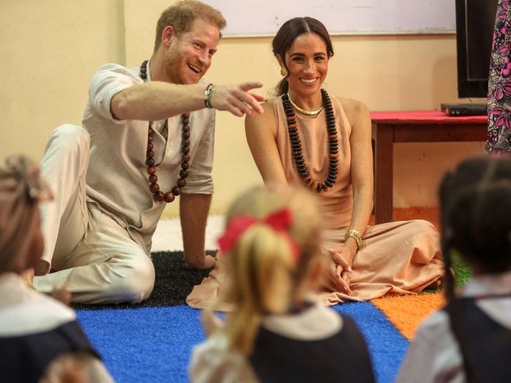 Britain's Prince Harry (L), Duke of Sussex, and Britain's Meghan (R), Duchess of Sussex, meet with children during their visit at the Lightway Academy in Abuja on May 10, 2024 as they visit Nigeria as part of celebrations of Invictus Games anniversary.